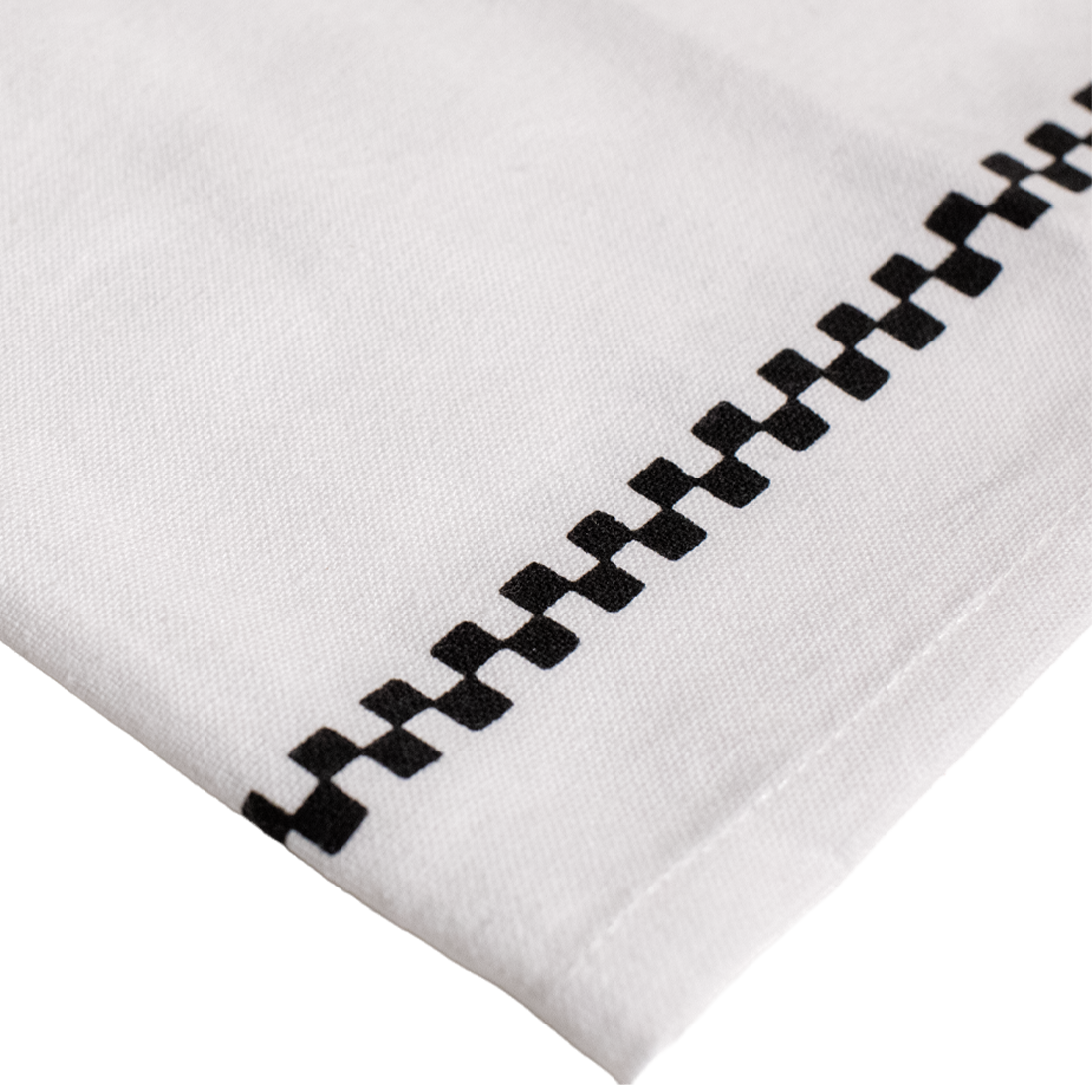 White fabric with black geometric pattern on a white background