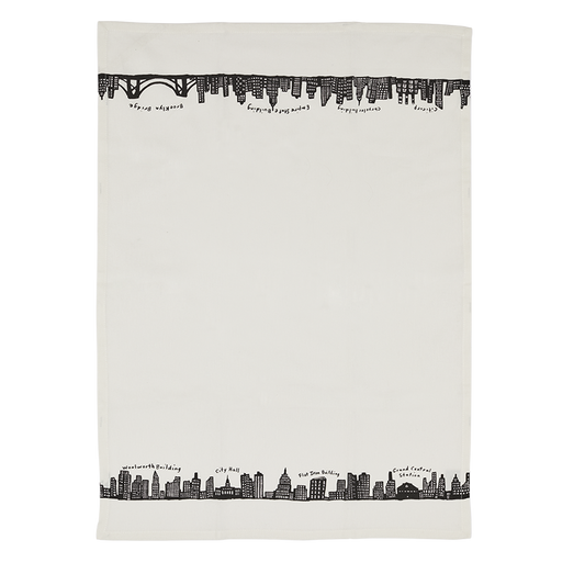 White towel with black city skyline design on a white background