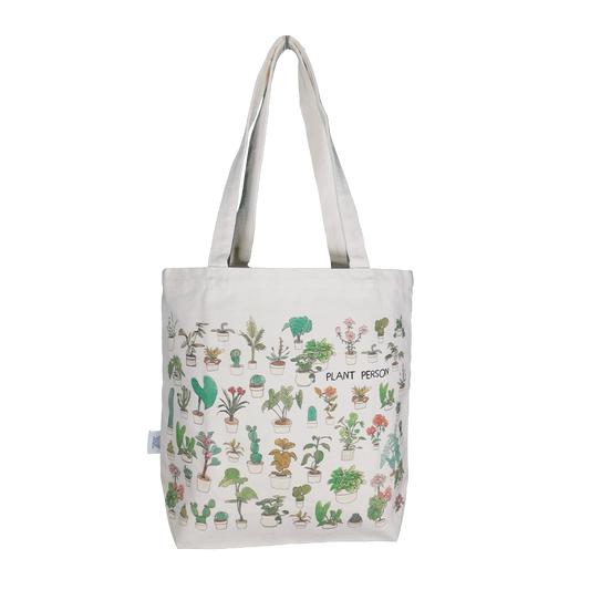 A beige tote bag with a pattern of various plants and the text 'PLANT PERSON' across the bottom.