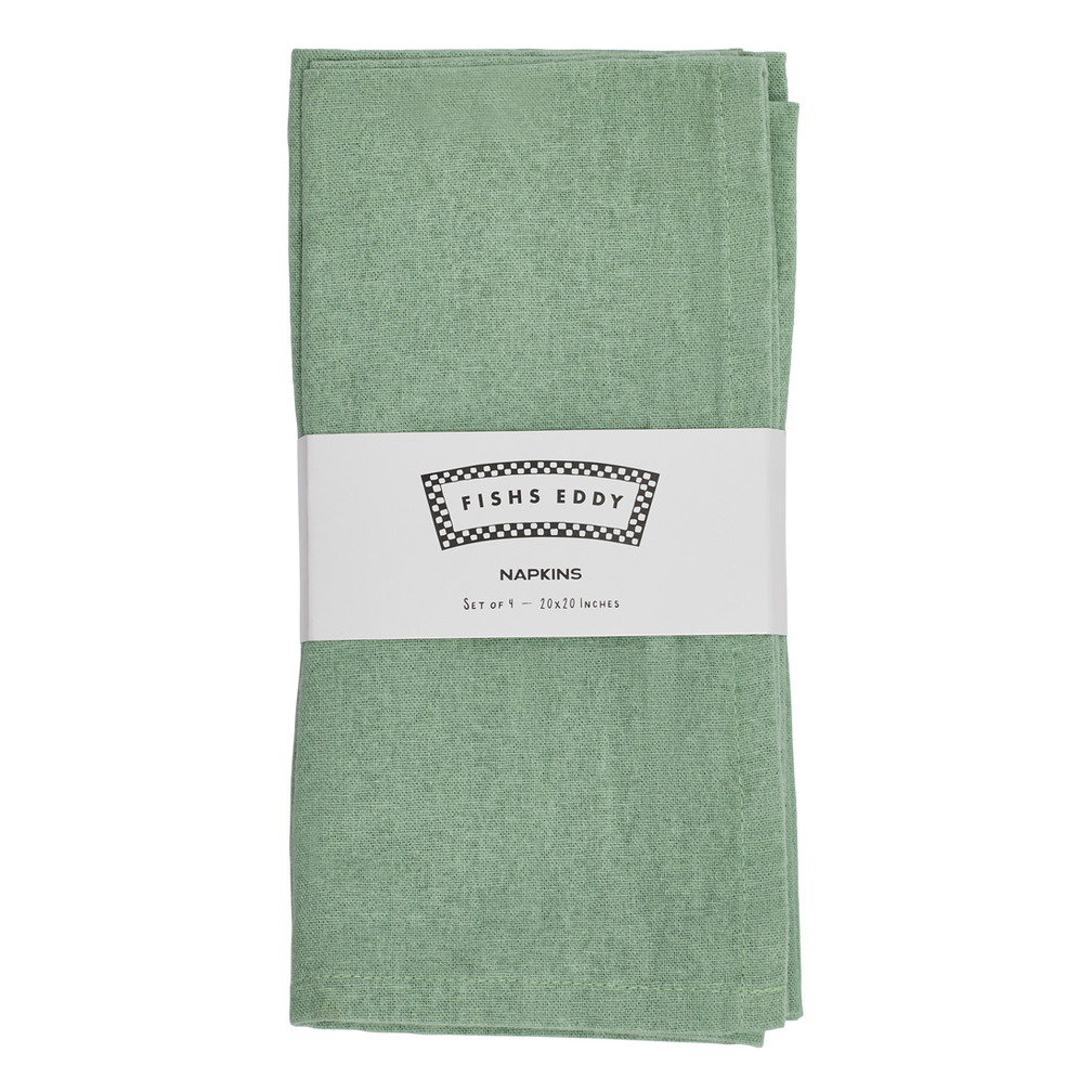 Folded green napkin with a label on a white background