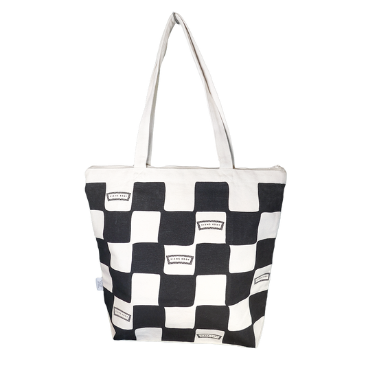 A large tote bag with a black and white checkerboard pattern.