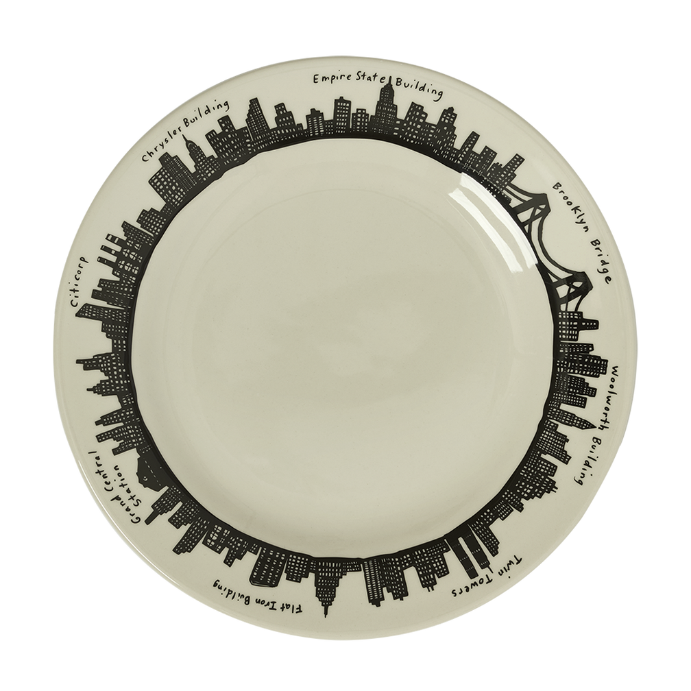 Round plate with black city skyline design on a white background