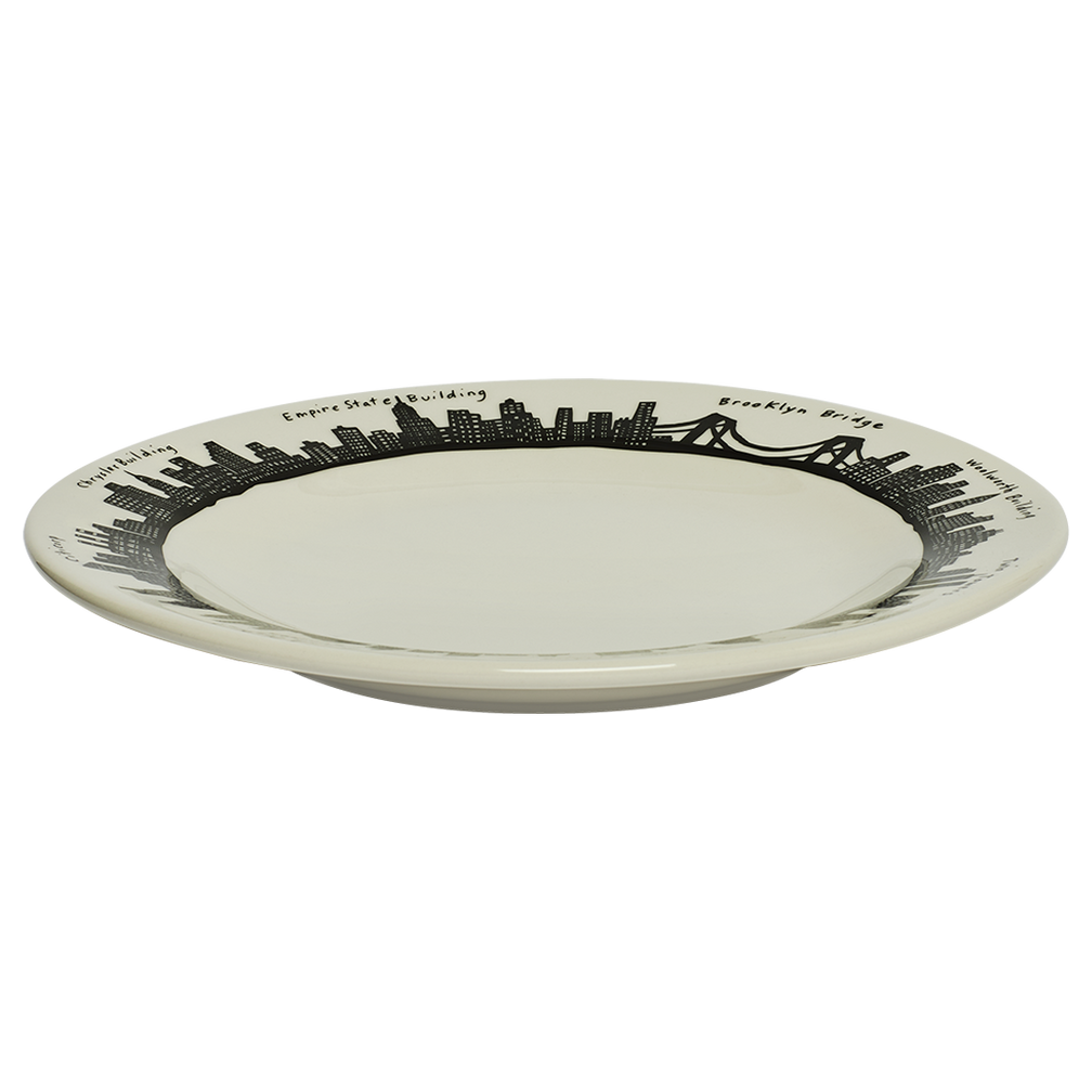 White plate with black city skyline design on a white background