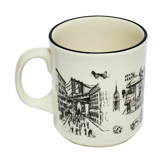 White mug with black cityscape design on a white background