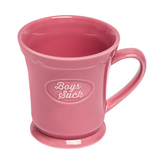 Pink mug with 'Boys Suck' text on a white background