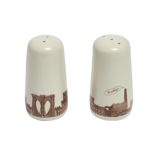 Two ceramic salt and pepper shakers with a Brooklyn Bridge design on a white background