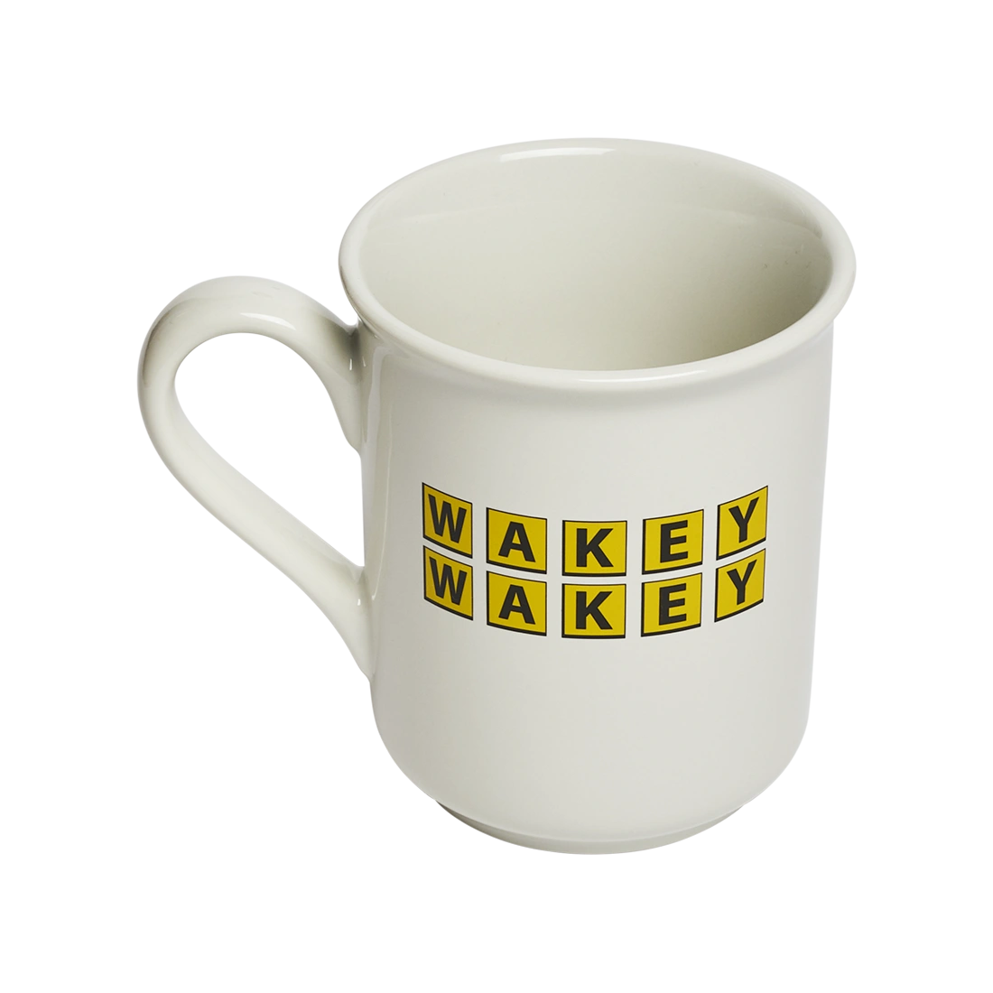 Novelty coffee mug featuring bold “WAKEY WAKEY” typography on durable white ceramic. Fun gift mug for coffee drinkers, tea lovers, coworkers, and anyone who is not naturally a morning person. Three-quarter view.