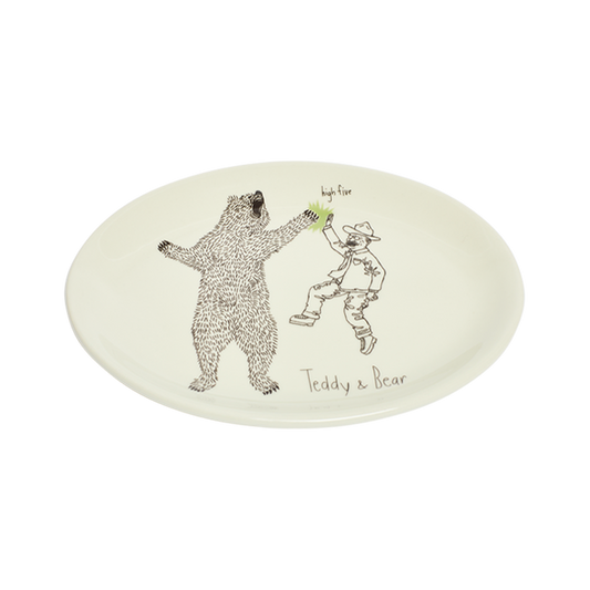 Round ceramic plate with illustrations of a bear and a person, featuring the brand 'Teddy & Bear'.