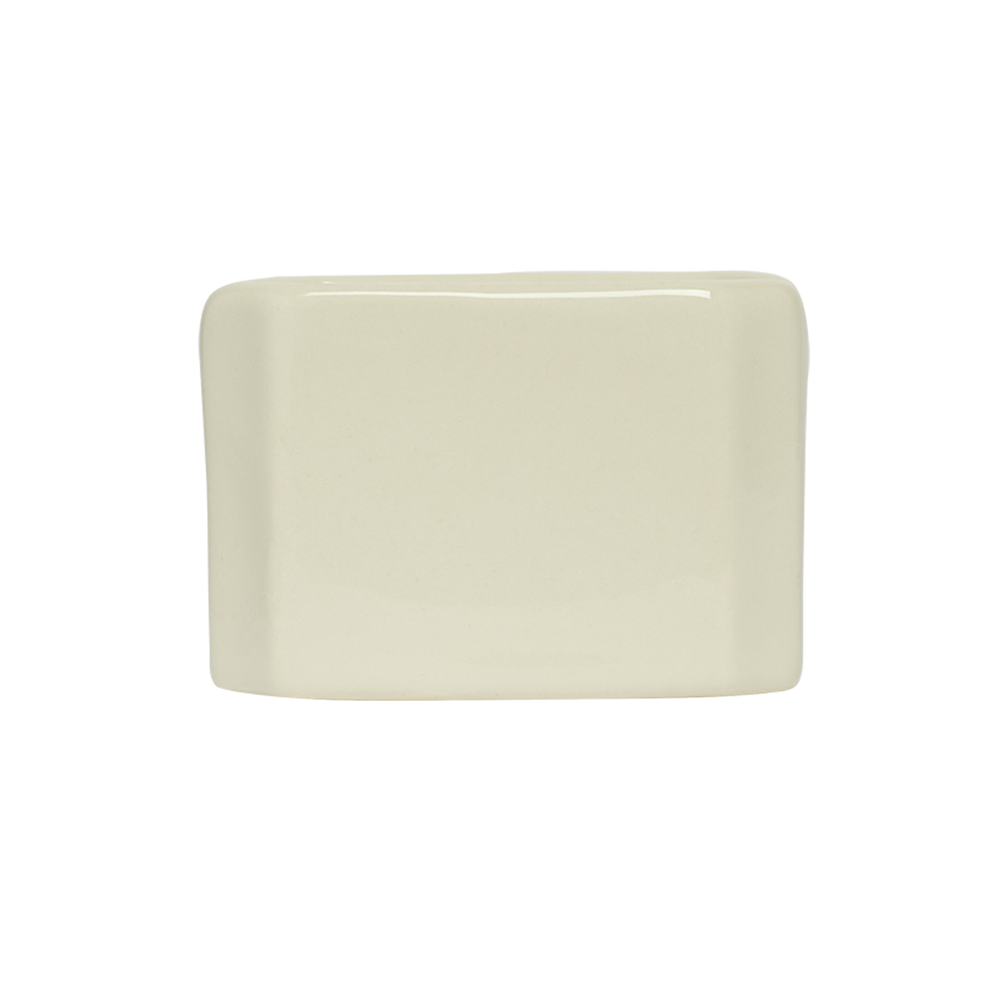 Rectangular beige ceramic plate on a white background