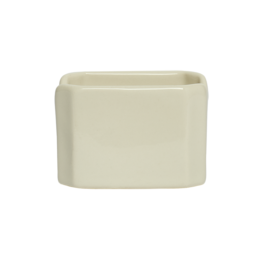 Beige rectangular ceramic planter on a white background