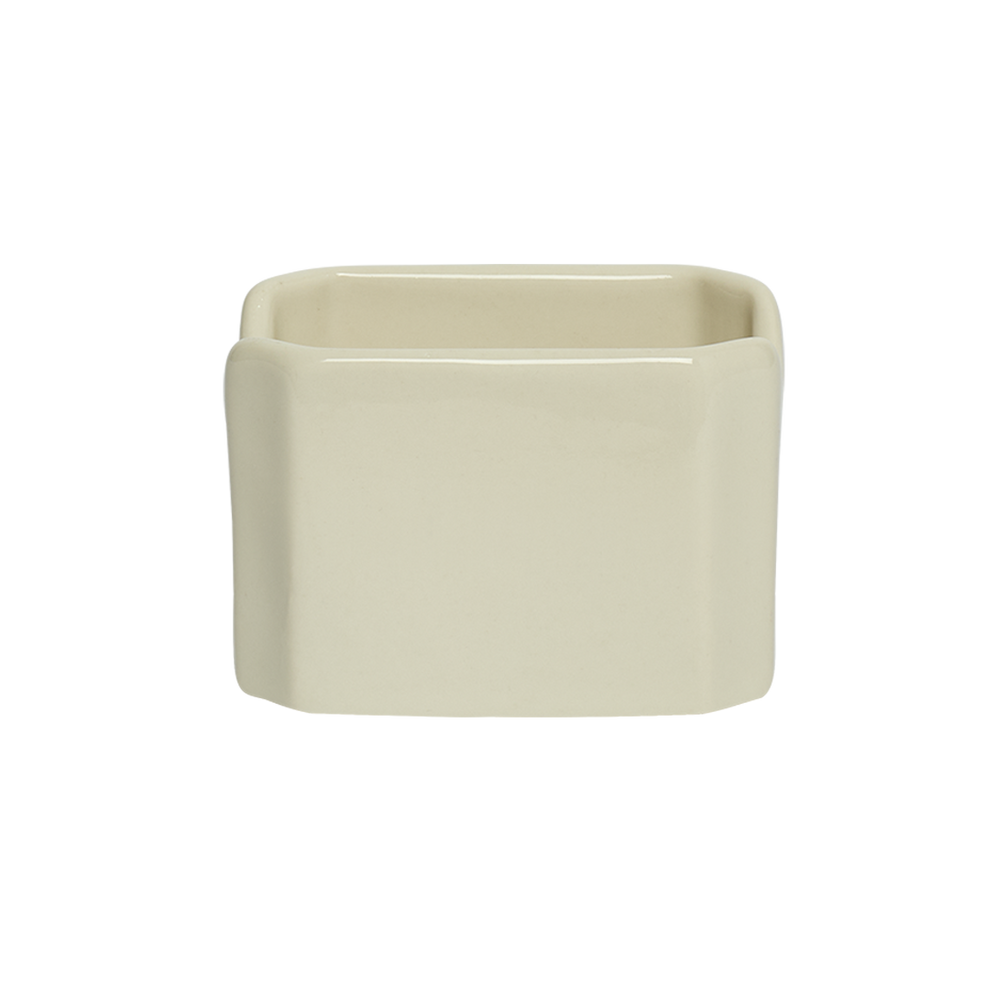 Beige ceramic planter on a white background