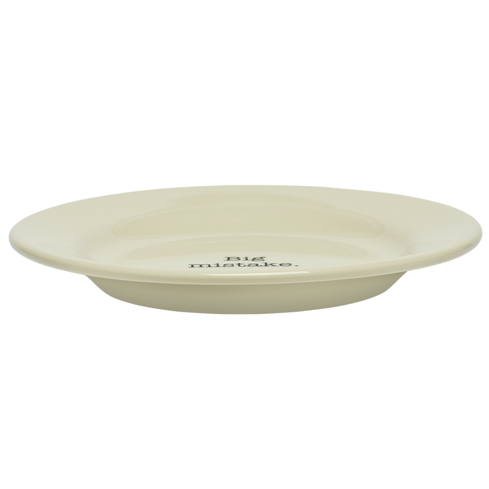 Beige ceramic plate with 'Big mistake.' text on a white background