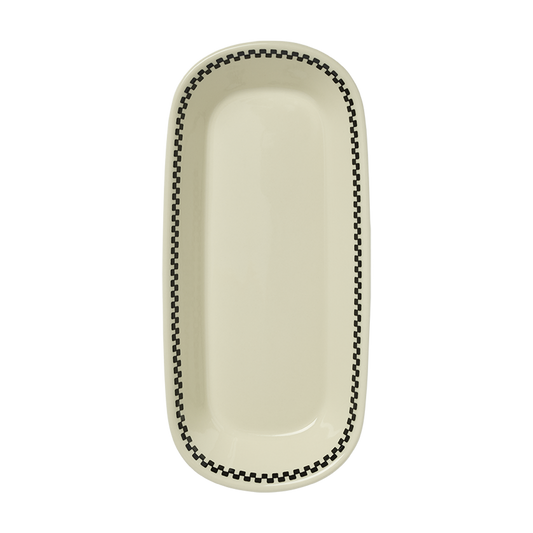 An oval-shaped ceramic Celery tray with a checkerboard pattern along the border, primarily in white and black colors.