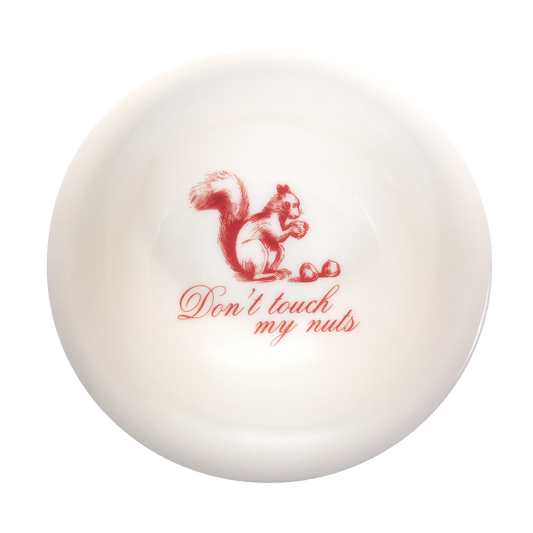A white bowl with a red squirrel illustration and the phrase 'Don't touch my nuts' printed on it.