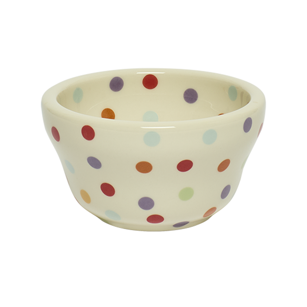 Ceramic bowl with colorful polka dot pattern on a white background