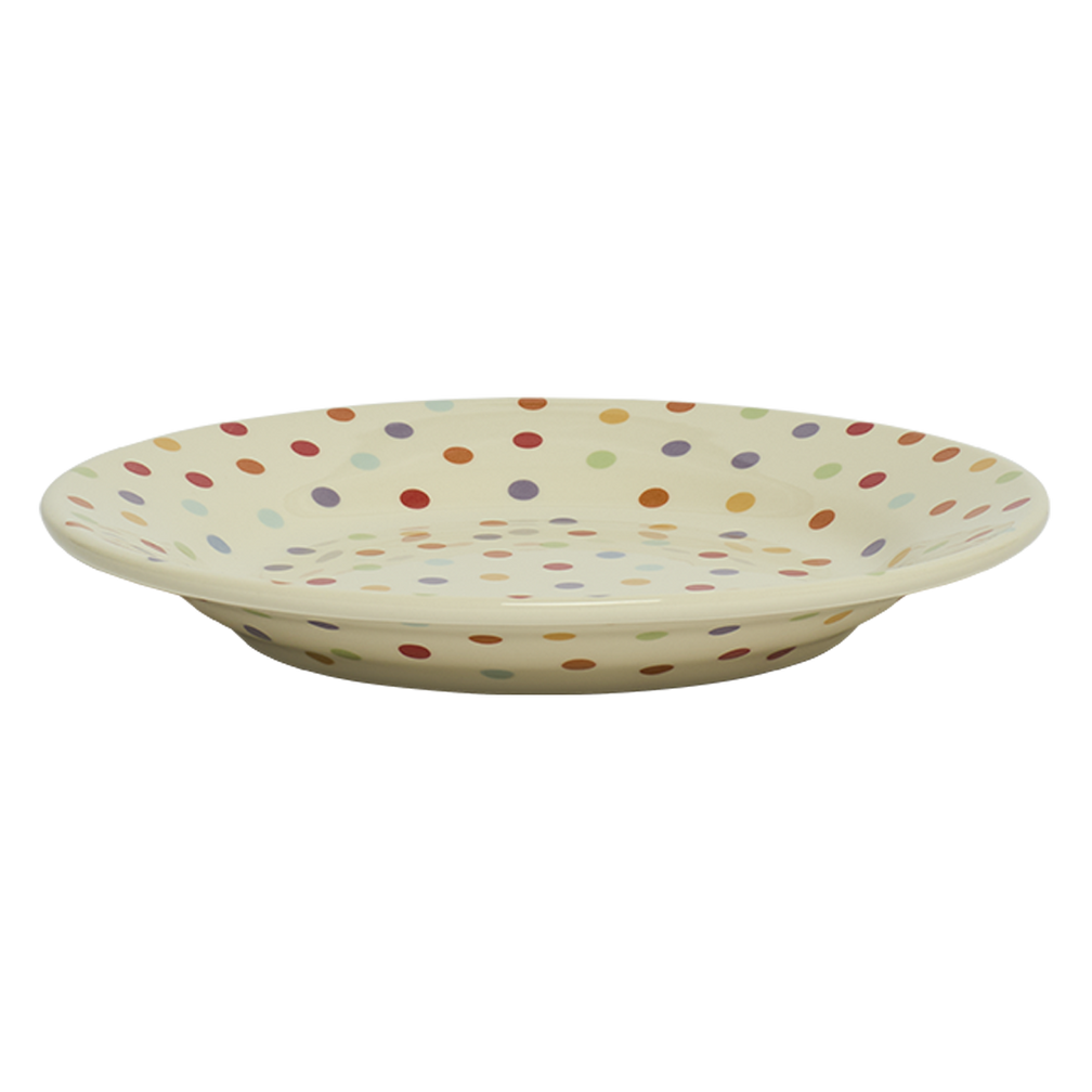 Ceramic bowl with multicolored polka dot pattern on a white background
