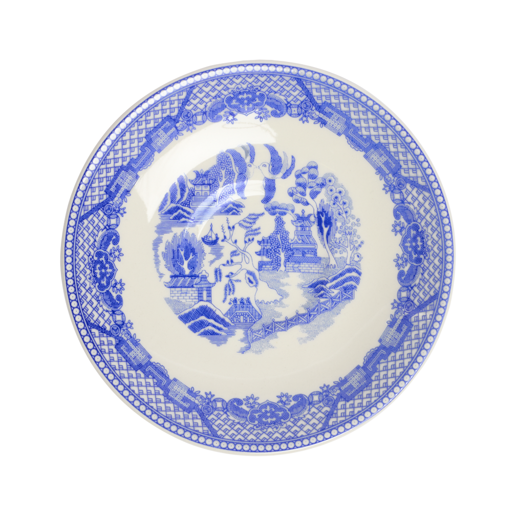 Blue and white patterned plate on a white background