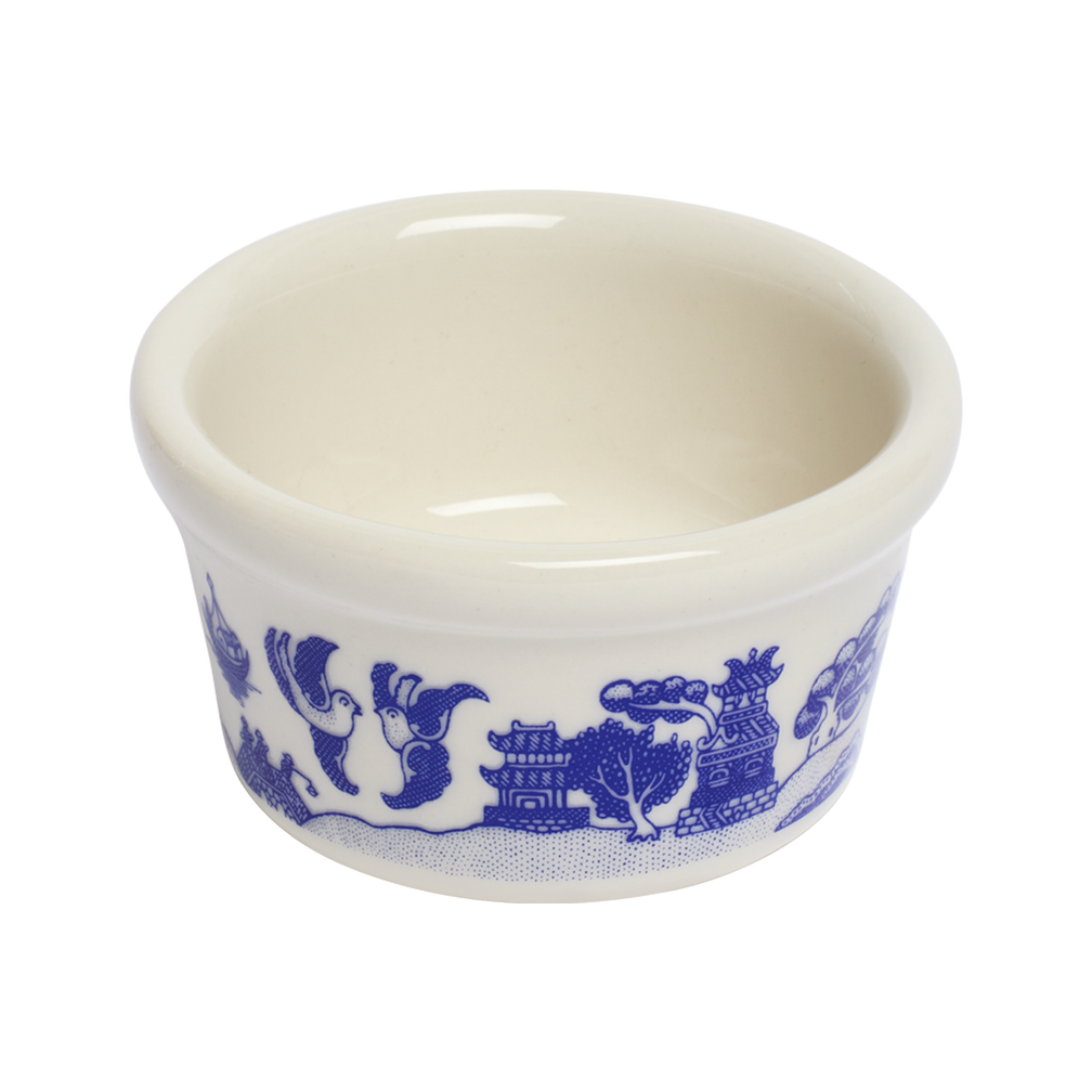 White ceramic cup with blue decorative pattern on a white background