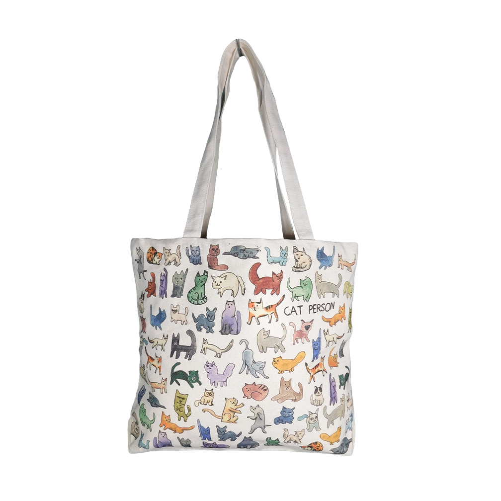 Canvas tote covered in colorful hand-drawn cats with the words 'CAT PERSON', front view