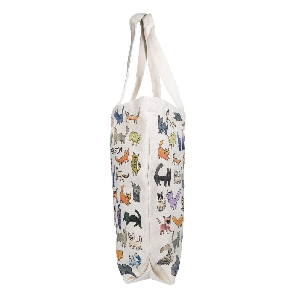 Cat Person canvas tote with an all-over cat print, side view