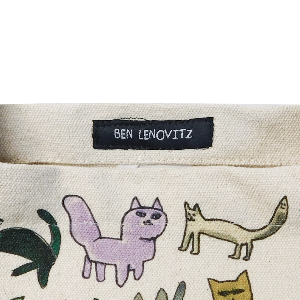 Close-up of the Cat Person tote showing drawn cats and a 'BEN LENOVITZ' woven label