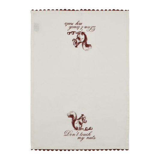 Full view of the Don’t Touch My Nuts tea towel with vintage squirrel illustration, playful script text, and red scalloped edge detail