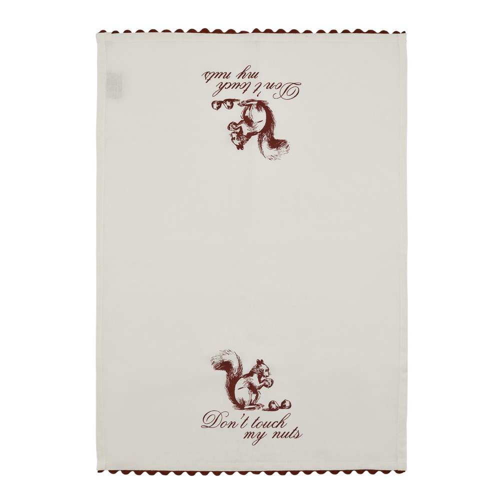 Full view of the Don’t Touch My Nuts tea towel with vintage squirrel illustration, playful script text, and red scalloped edge detail