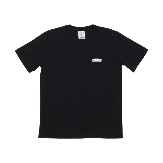 Black t-shirt with a small logo on the chest against a white background
