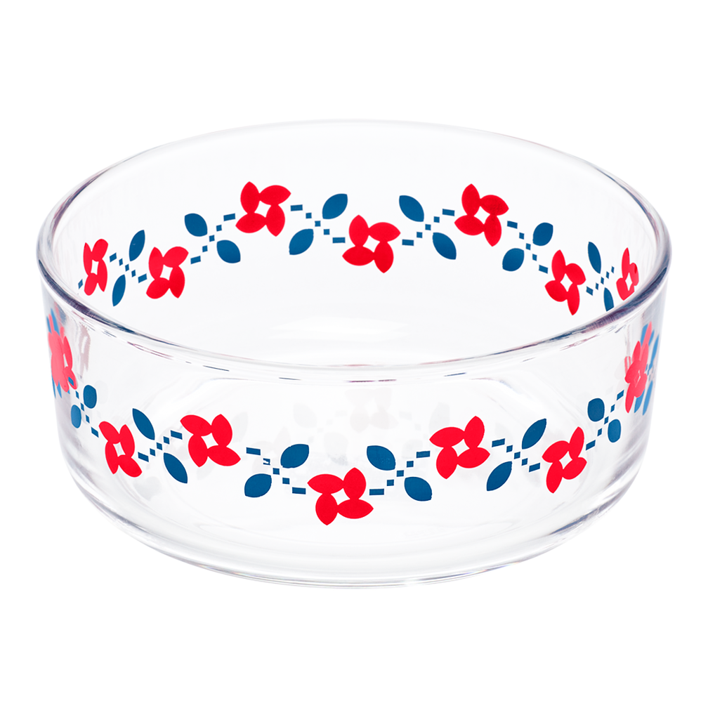 Clear glass bowl with red and blue floral pattern on a white background