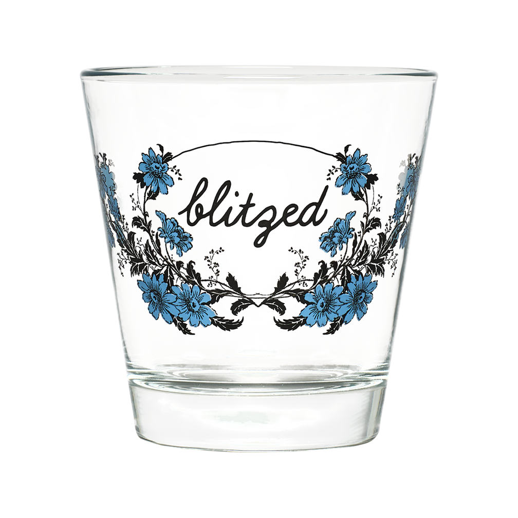 Clear glass with floral design and 'blitzed' text on a white background