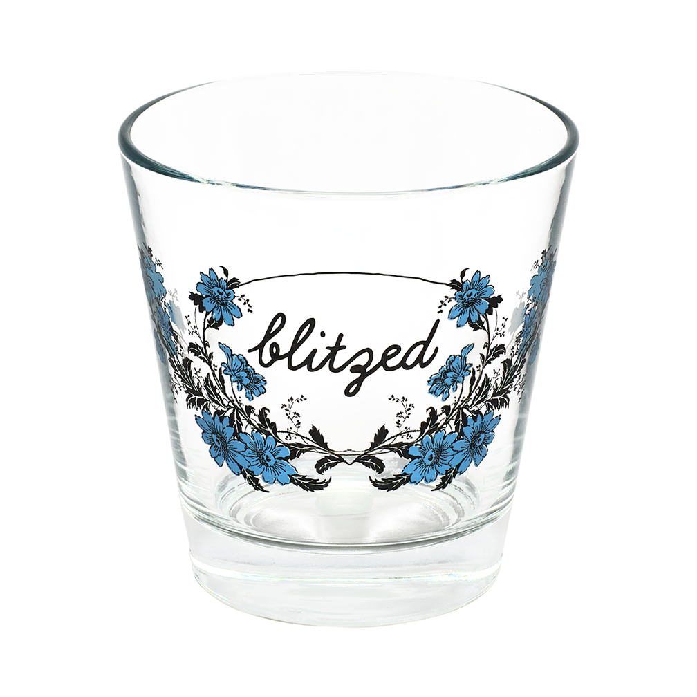 Clear glass with floral design and 'blitzed' text on a white background