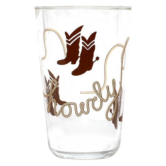 Clear glass tumbler with cowboy boot and lasso design on a white background