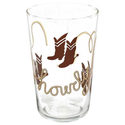 Clear glass tumbler with cowboy boot design and 'Showell' text on a white background