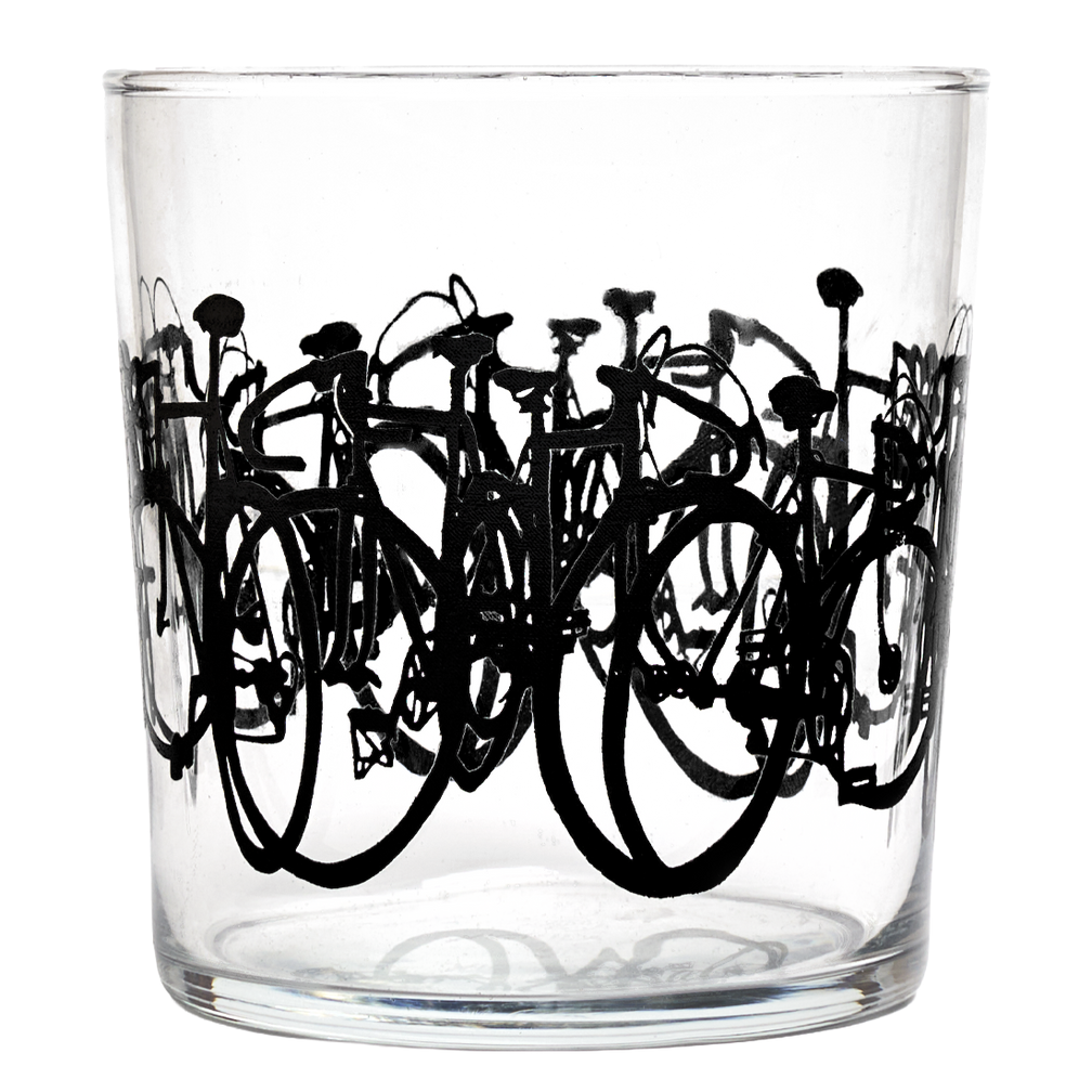 Clear glass tumbler with black bicycle illustrations on a white background