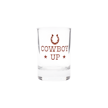 Clear shot glass with rust-colored “Cowboy Up” lettering, horseshoe graphic, and star accents