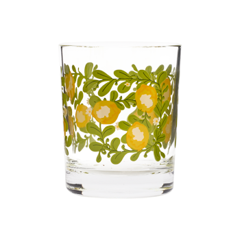 Clear rocks glass with yellow lemon illustrations, green leaves, and small white floral accents.