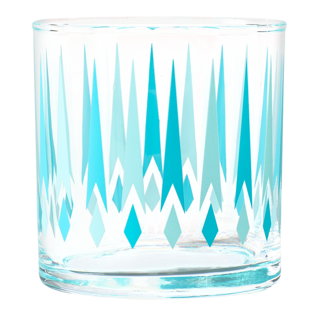 Clear glass tumbler with blue and white geometric pattern on a white background