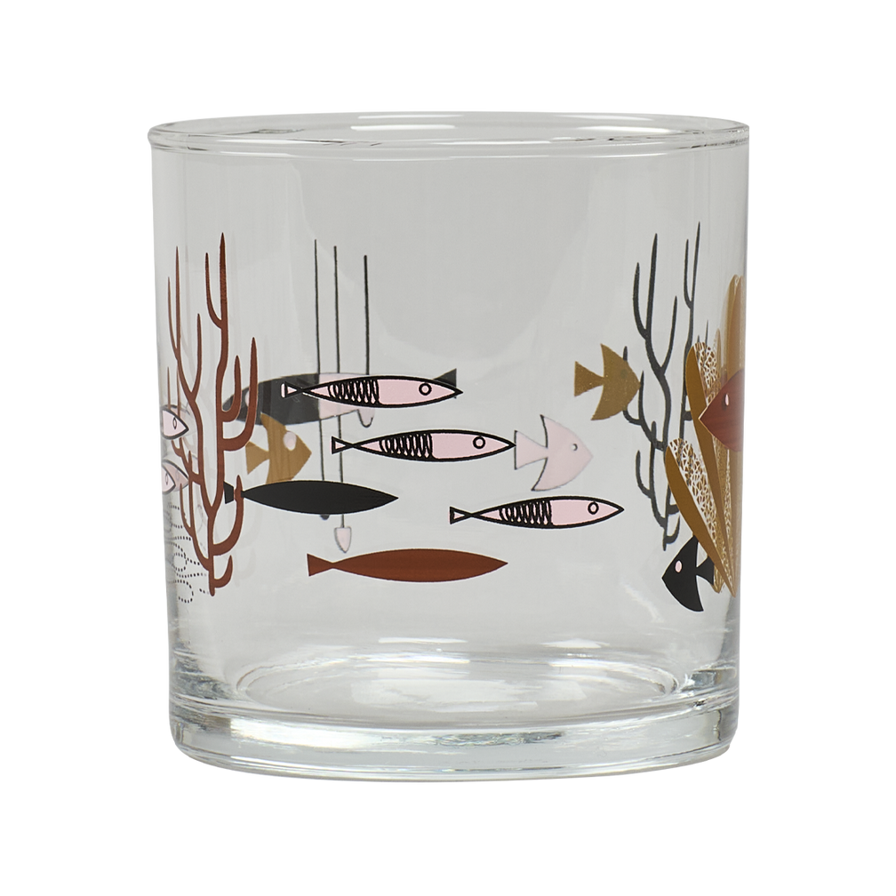 Clear glass tumbler with fish and coral design on a white background