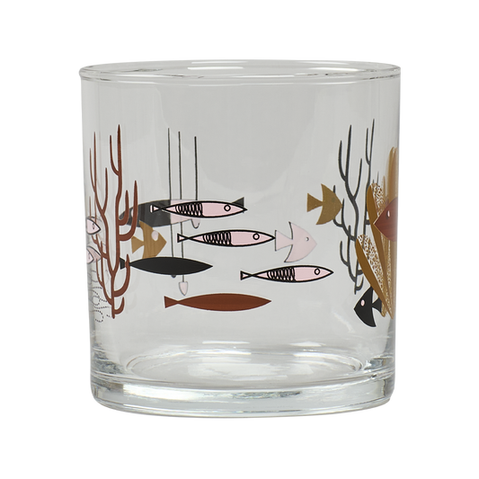 Clear glass tumbler with fish and coral design on a white background