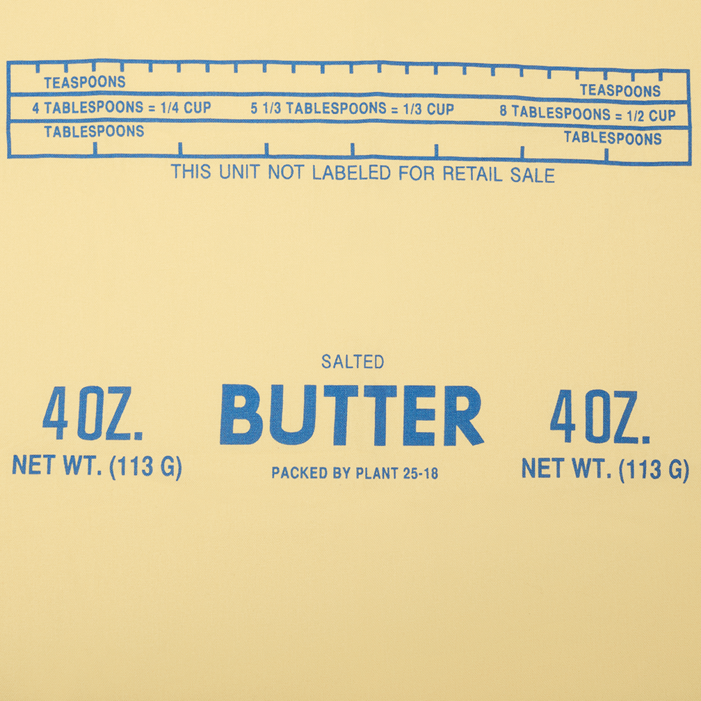 Butter packaging with measurement chart on a beige background