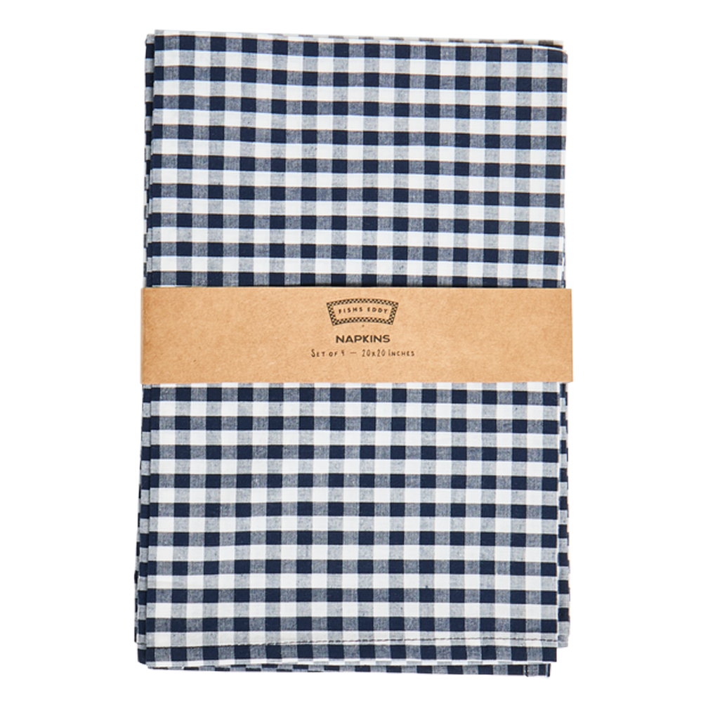 Folded blue and white checkered napkins with a brown band and brand label on a white background
