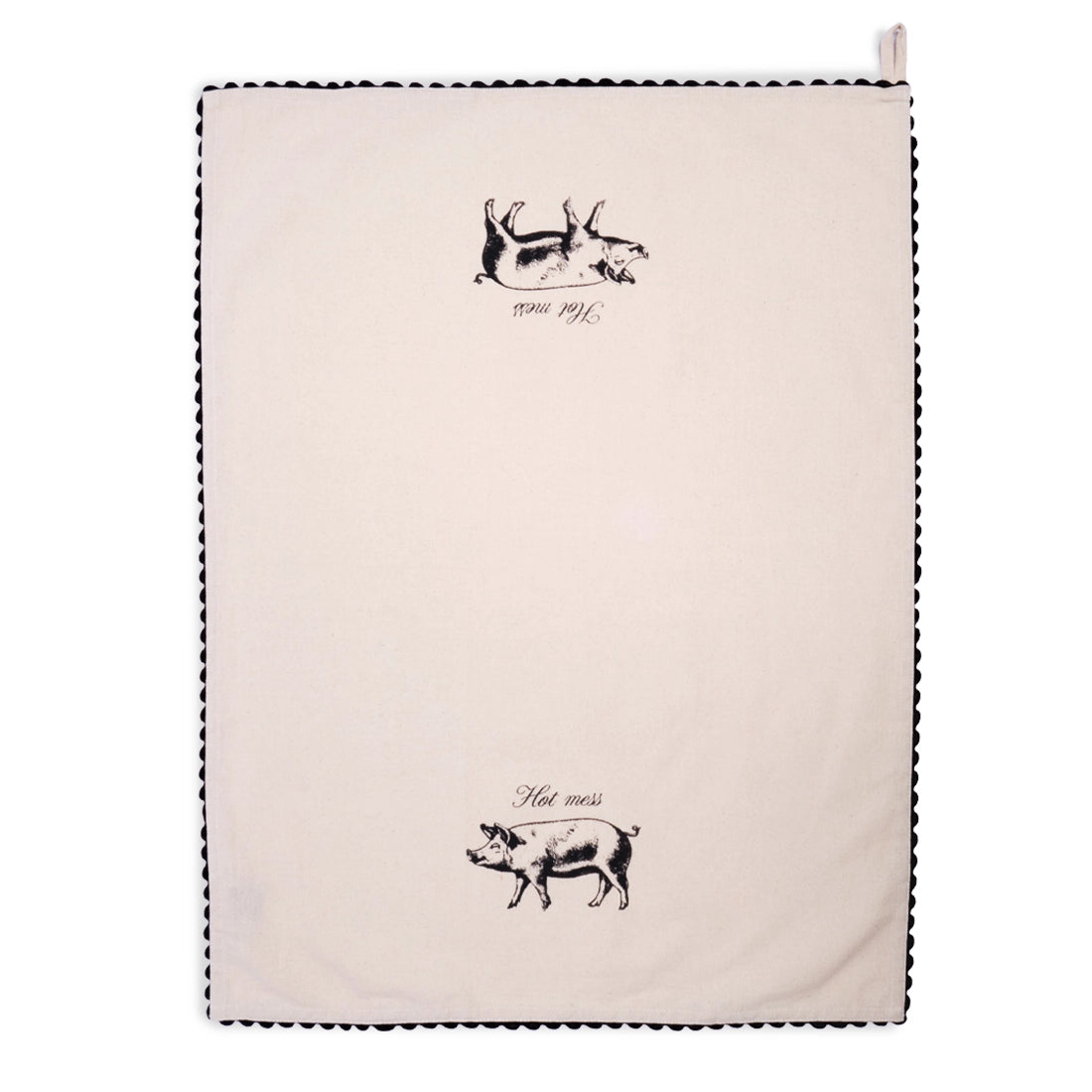 Cream Hot Mess pig tea towel draped in an inverted V shape, with a black illustrated pig and “Hot mess” lettering on the left panel and black scalloped trim along the edges.