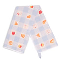 Light blue and white gingham apple pie tea towel draped in an inverted V shape, showing red apples and golden pie illustrations across both hanging panels.