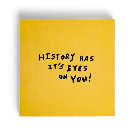 History Has Its Eyes On You decorative matchbox with yellow cover.
