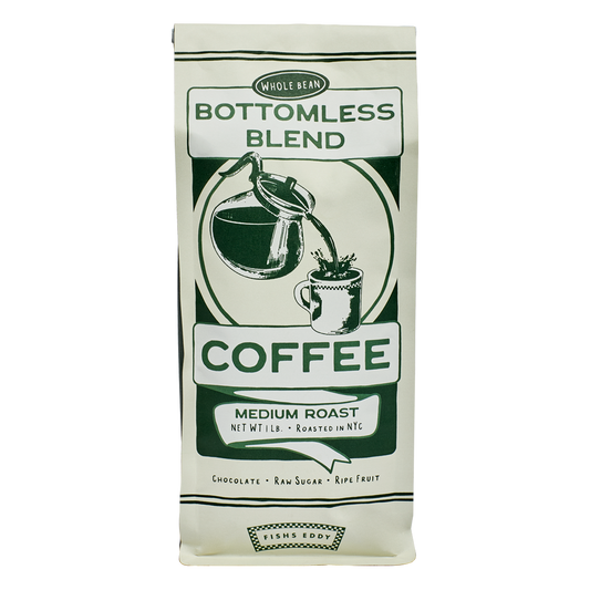 Coffee bag labeled 'Bottomless Blend' with a green and white design on a white background