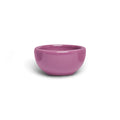 Small mauve orchid pink ceramic nut bowl with rounded sides, side view