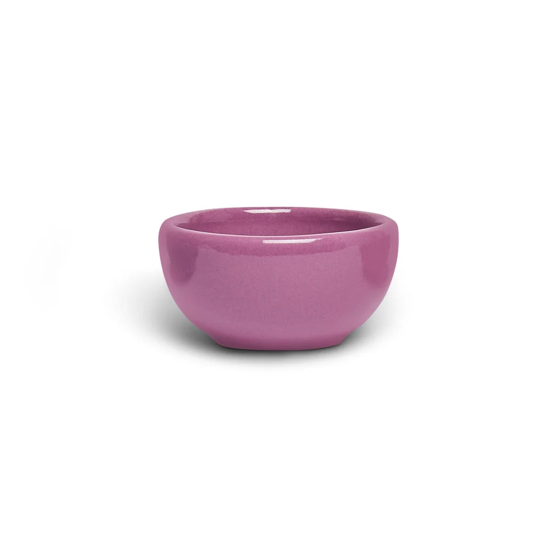 Small mauve orchid pink ceramic nut bowl with rounded sides, side view