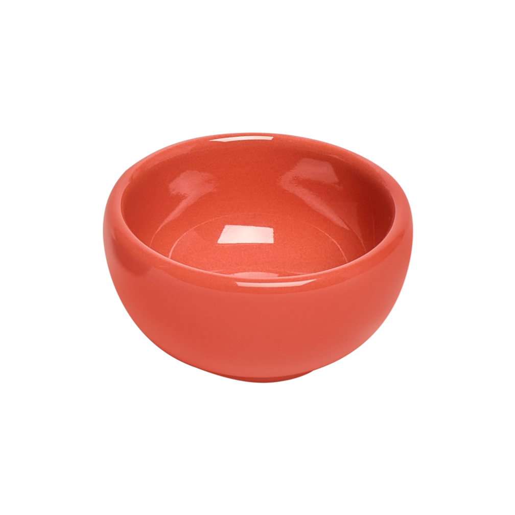 Red ceramic bowl on a white background