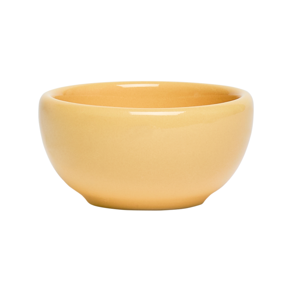 Yellow ceramic bowl on a white background
