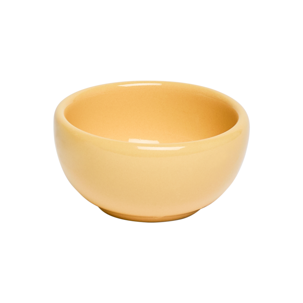 Yellow ceramic bowl on a white background